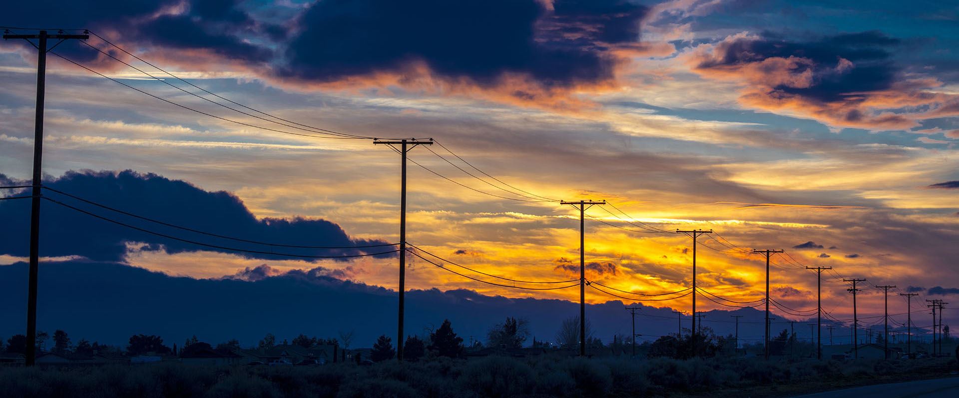 Telephone poles during sunset